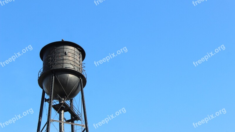 Black Water Tower Blue Sky Community Rusty