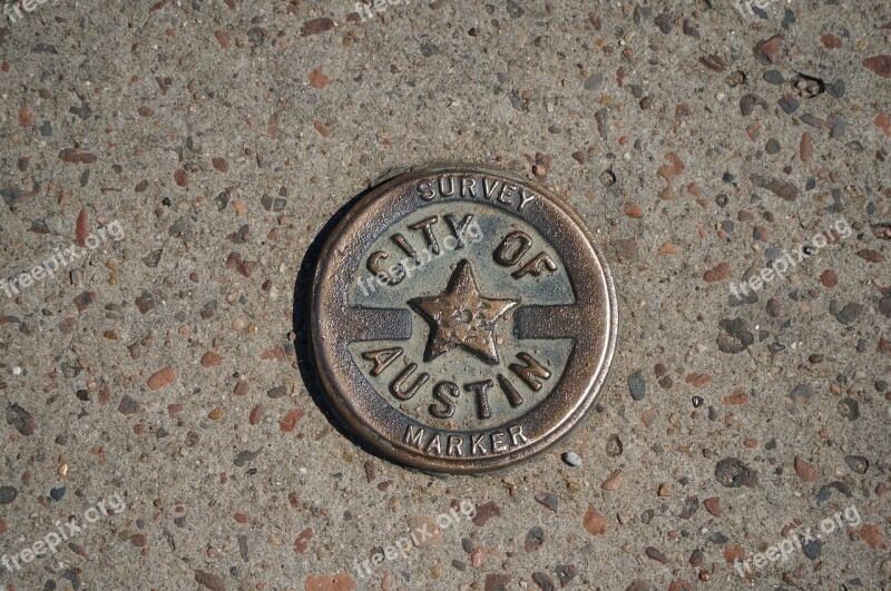 Old Medal Survey Sidewalk Austin