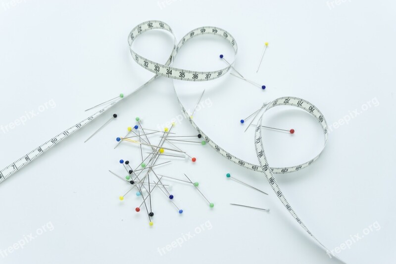 Tape Measure Sewing On A White Background Measure Pins