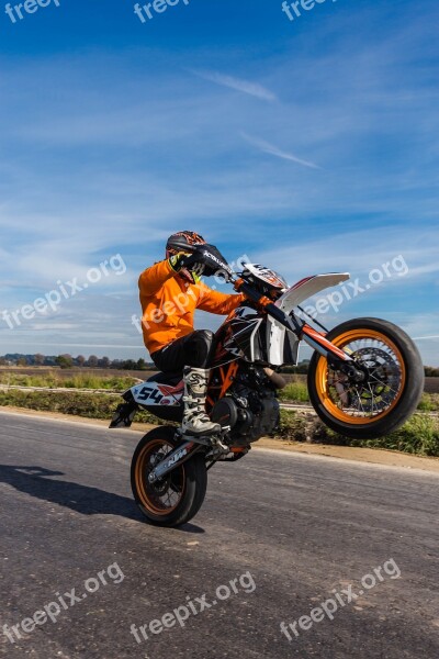 Motorcycle Wheelie Road Sky Field