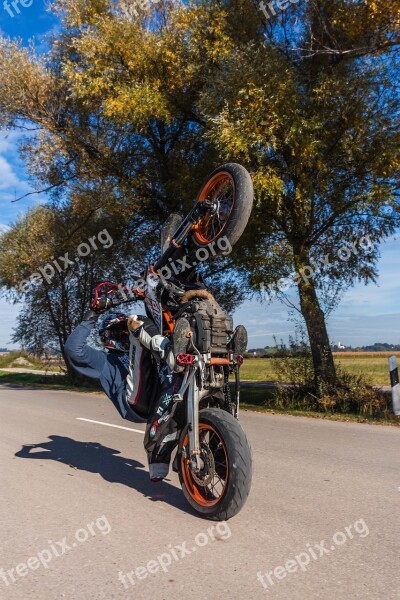 Motorcycle Wheelie Road Sky Field