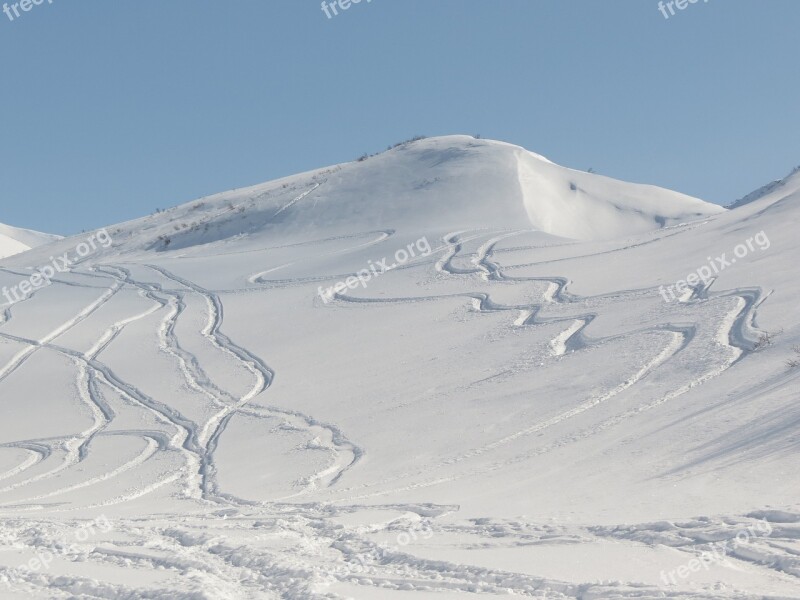 Volcano The Foot Slope Travel By Snowmobile Footprints In The Snow