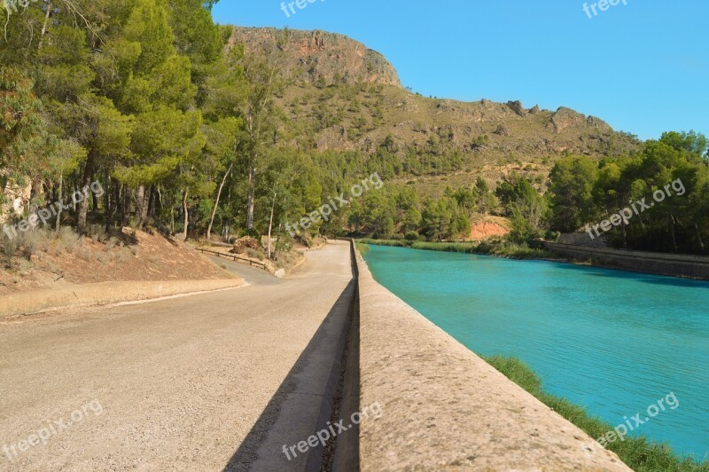 Contrast Turquoise Water Asphalt Separation Wall