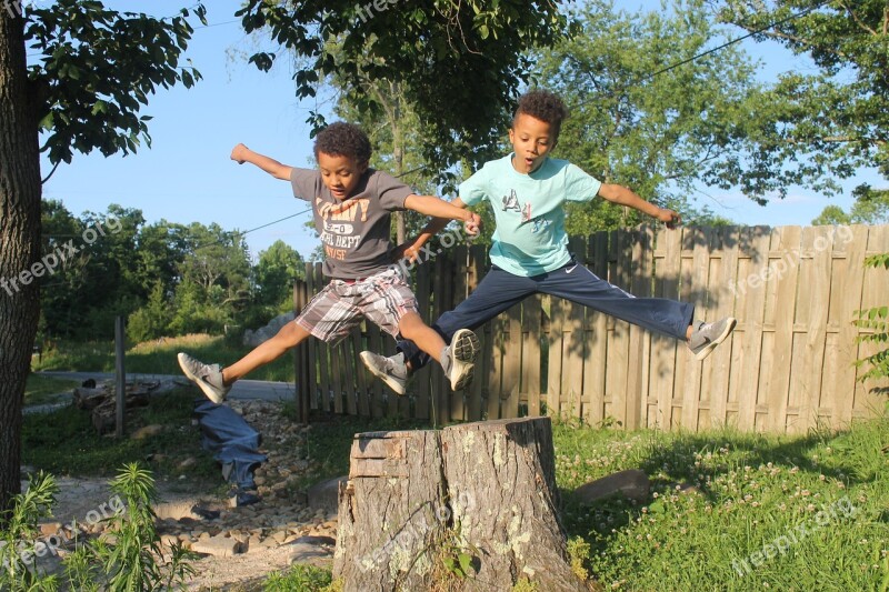 Boys Twins Jumping Outside Summer