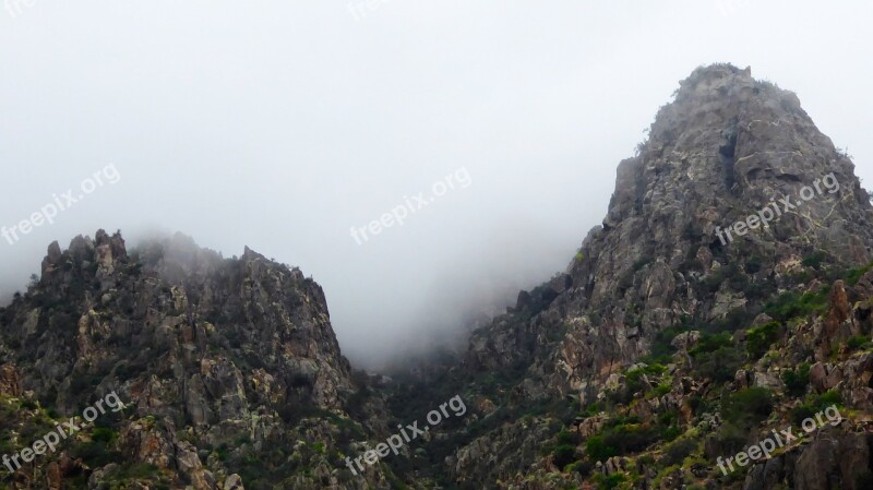 Two Mountains Fog Jagged Rocks Landscape