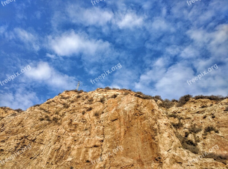 Cliff Sky Pylon Scenic Clouds