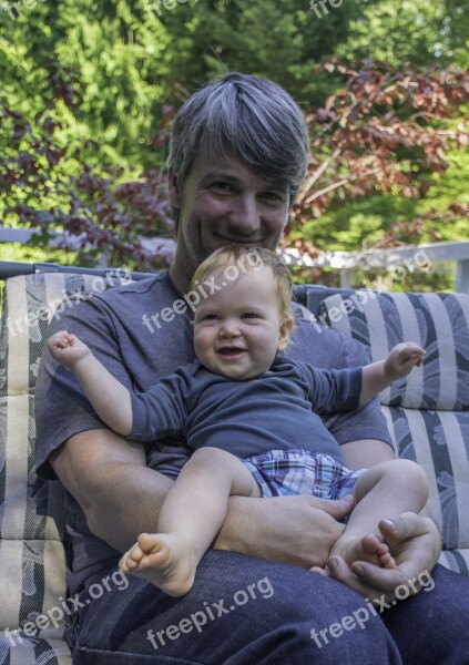 Father Son Smiling Baby Squirming