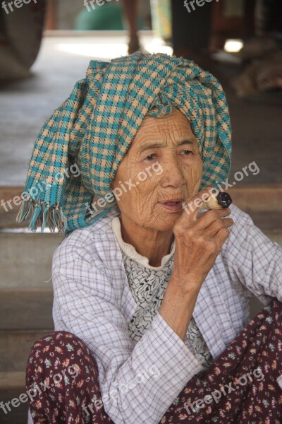 Old Woman Smoking Home-rolled Cigar