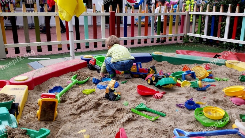 Child Sand Pit Play Colorful Digging