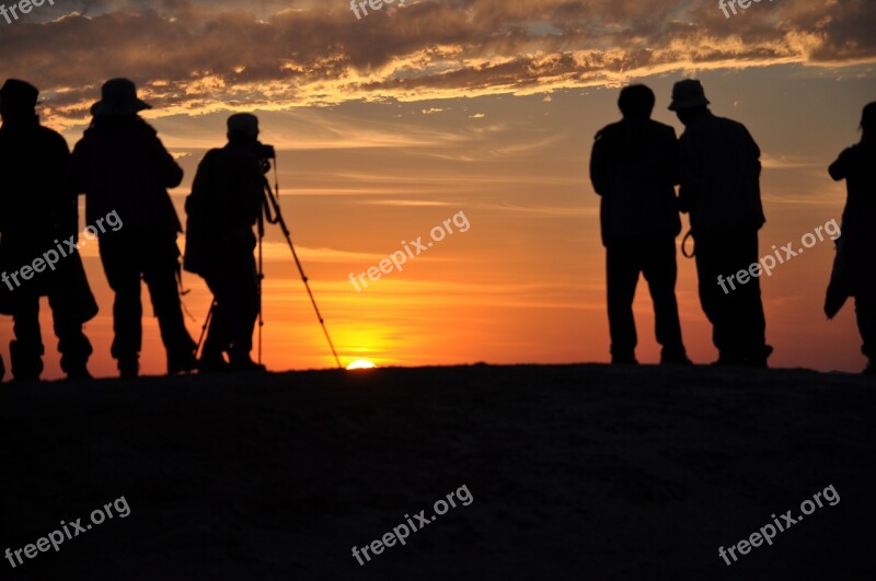 Silhouette In Xinjiang Ghost City People Sunset