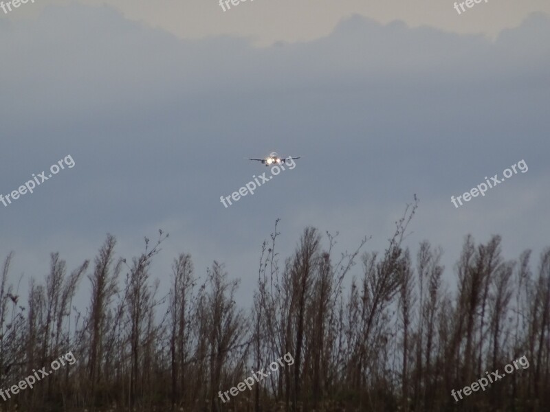 Aircraft Landing Spotlight Evening Clouds