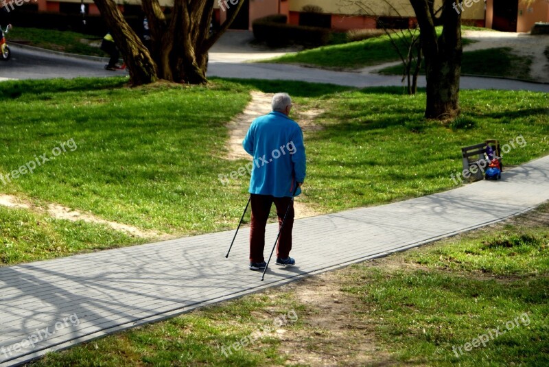 Older Man Reaching Go Sticks