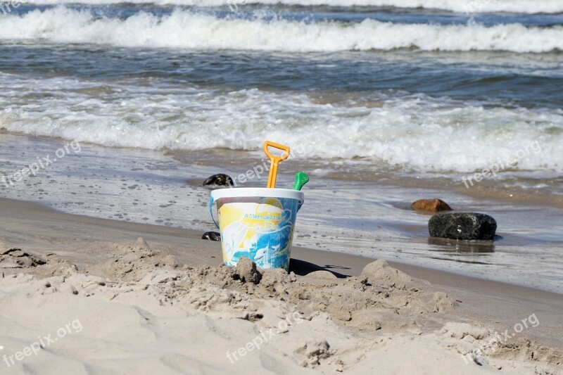 Toys Bucket Pokes Fun At Baltic Sea Sand