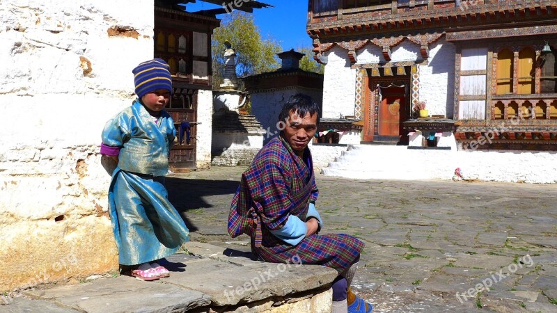 Bhutan Child With Father Resting Free Photos