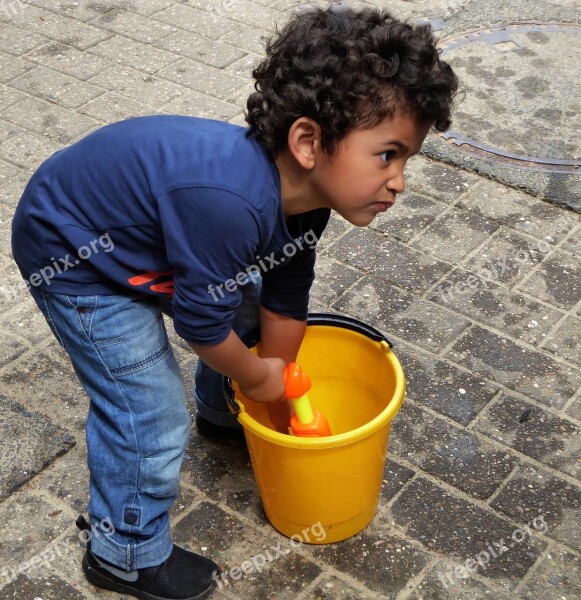 Little Boy Play Water Gun Bucket Close Up