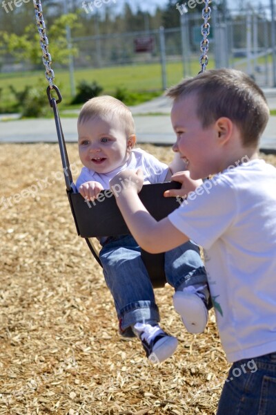 Swing Boys Play Swinging Children