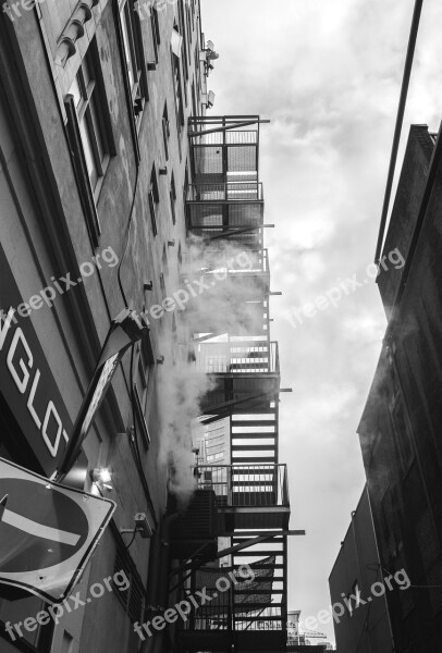 Fire Escape Stairs Alley Dark Clouds