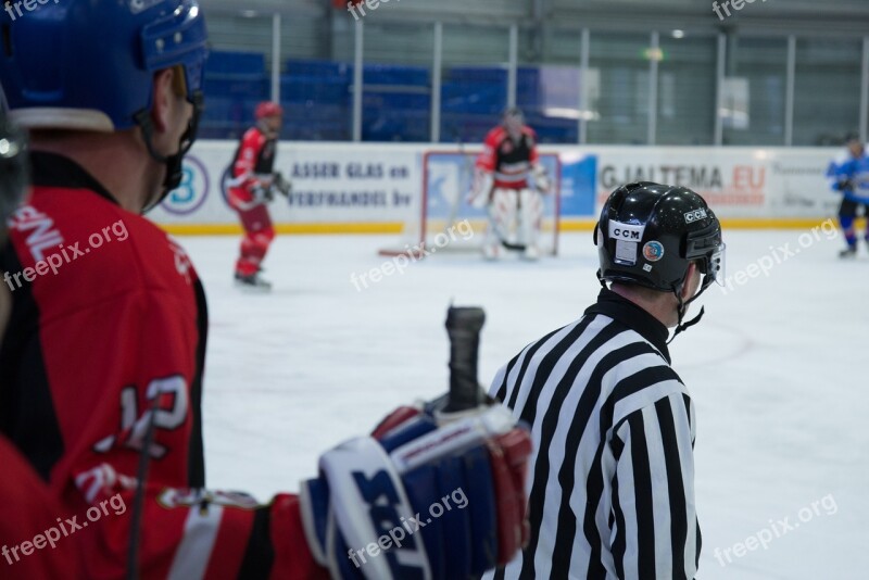 Ice Hockey Referee Skating Puck