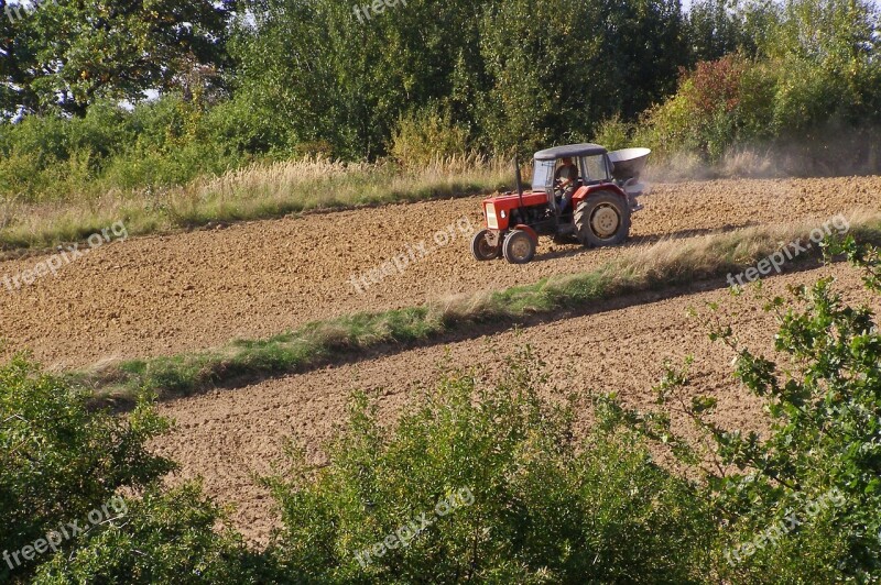 Tractor Agricultural Machine Working On The Field Dust Soil