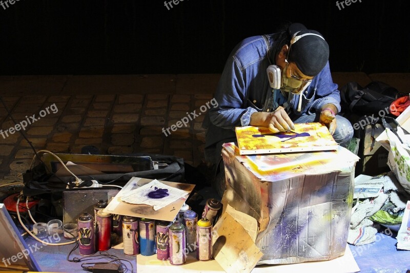 Street Artist Sidewalk Painter Seated Spray Paints