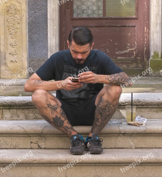 Man Mobile Phone Sitting Tattooed Stairs