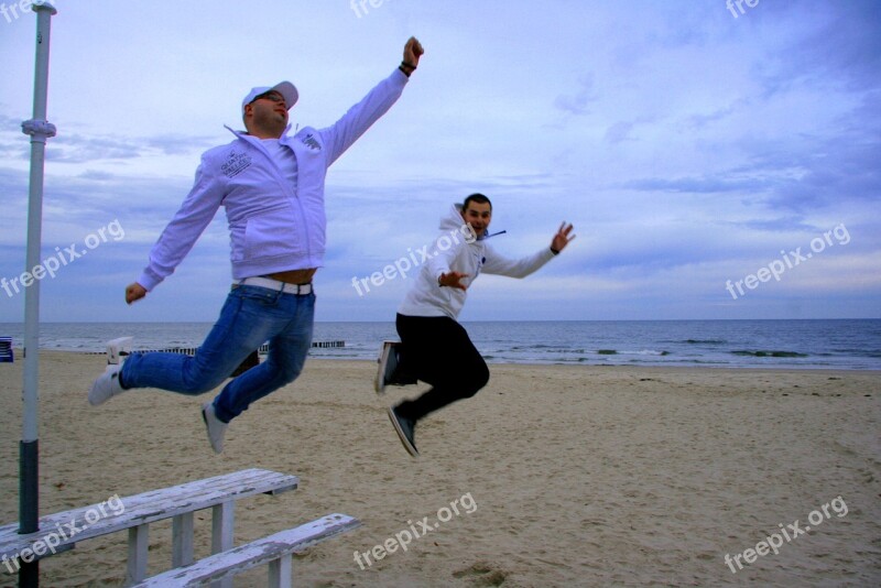 Jump Teamwork Sandy Beach Sea