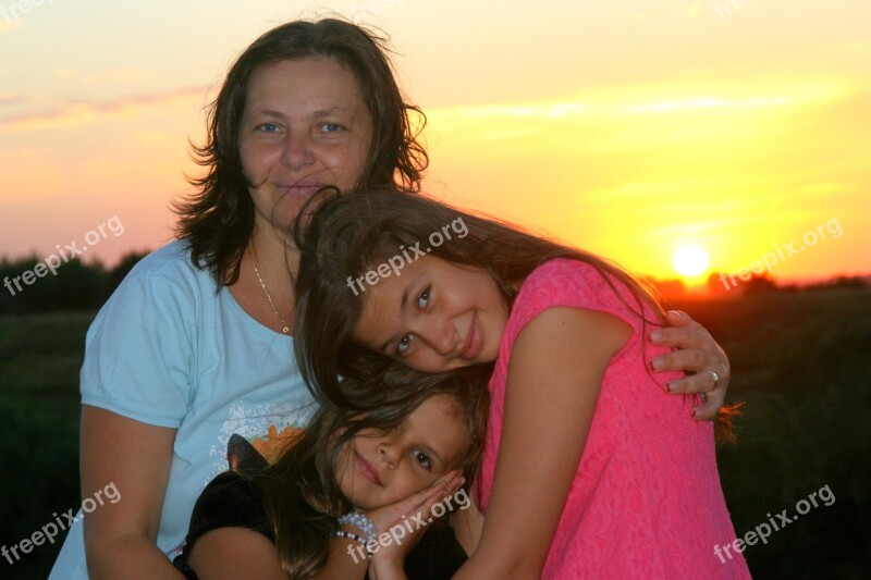 Family Mom Daughter Sunset Hug