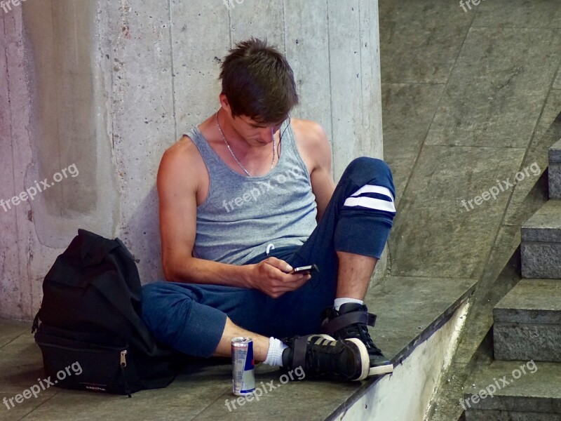 Man Young On The Ground Waiting Mobile