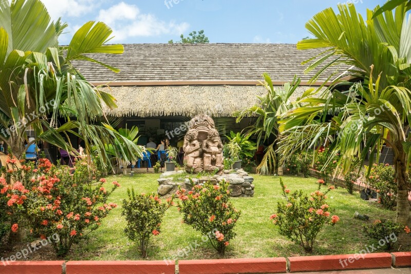 Nuva Hiva Marquesas Islands Garden Statue Flowers