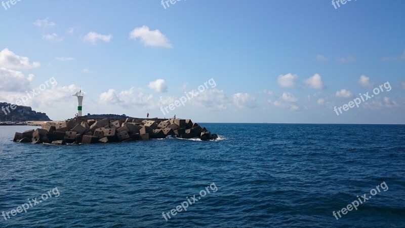 Blue Sea Stones Lighthouse Clouds Men