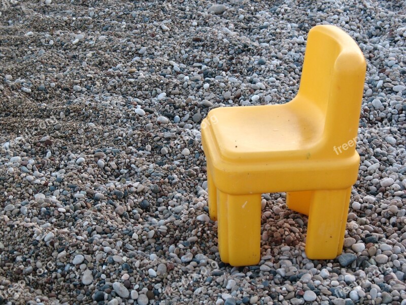 Pebbles Stones Beach Yellow Chair