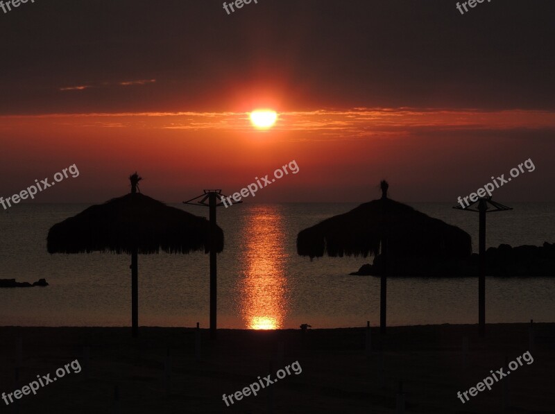 Dawn Sun Sea Sand Umbrellas