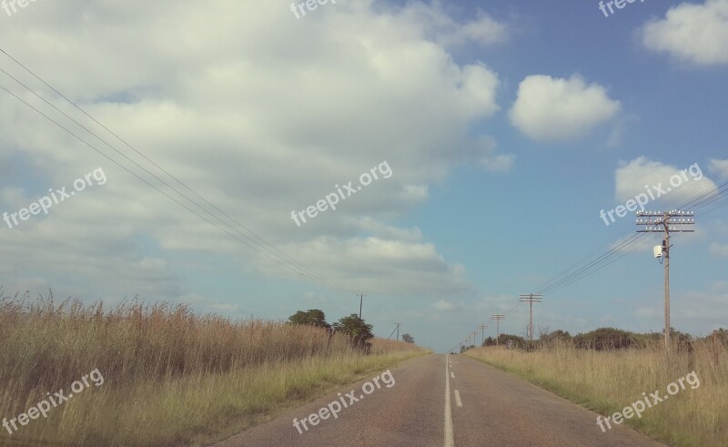 Rural Road Power Lines Grass Sky