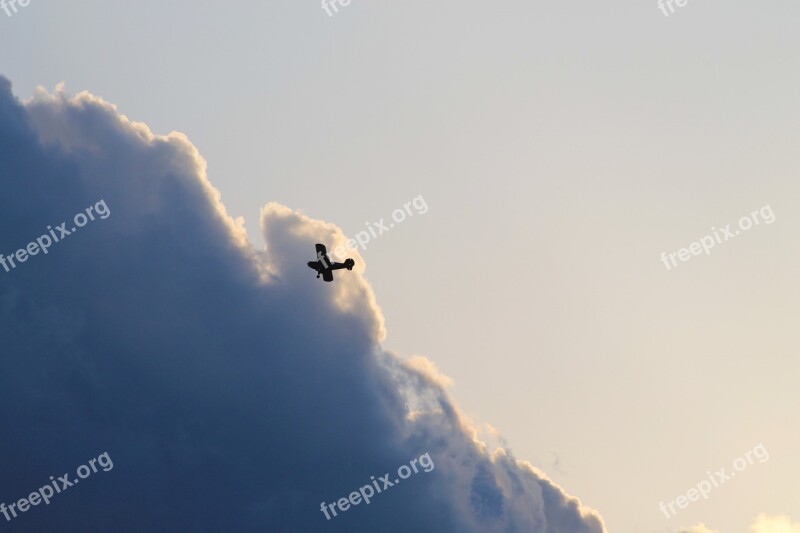 Split Bi-plane Air Show Thunderclouds Airplane