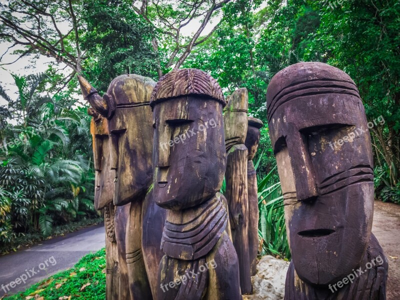 Wood Sculpture Faces Old Statue