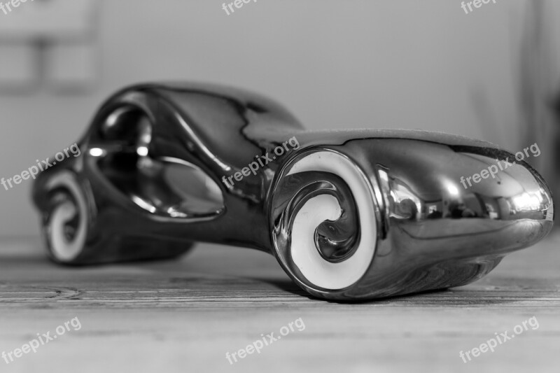 Car Statuette Black And White Shiny Streamline Reflection