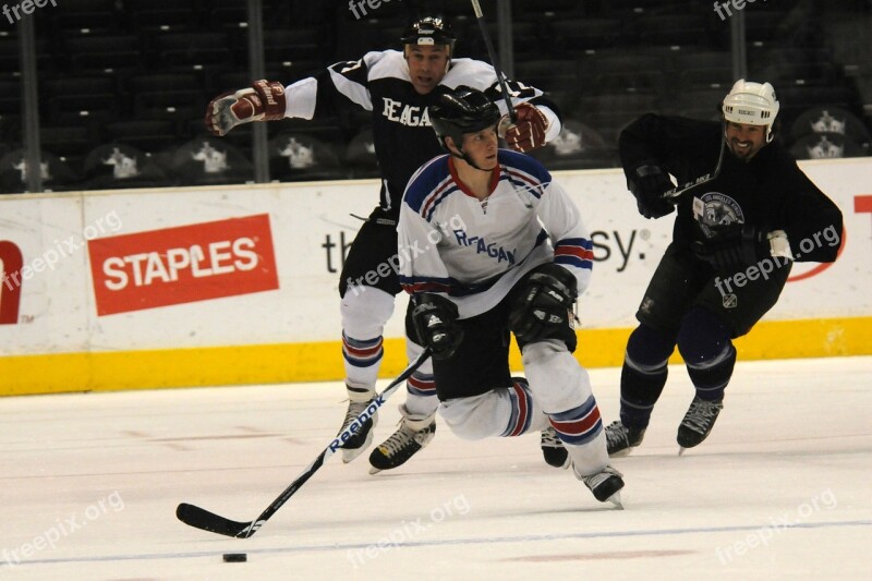 Ice Hockey Players Skating Puck Stick