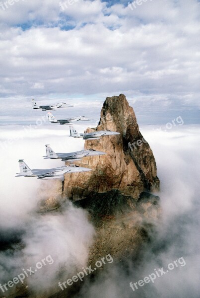 Military Aircraft Flying Formation F-15 Rock Formation