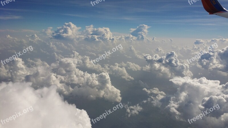 Fluffy White Clouds Airplane View