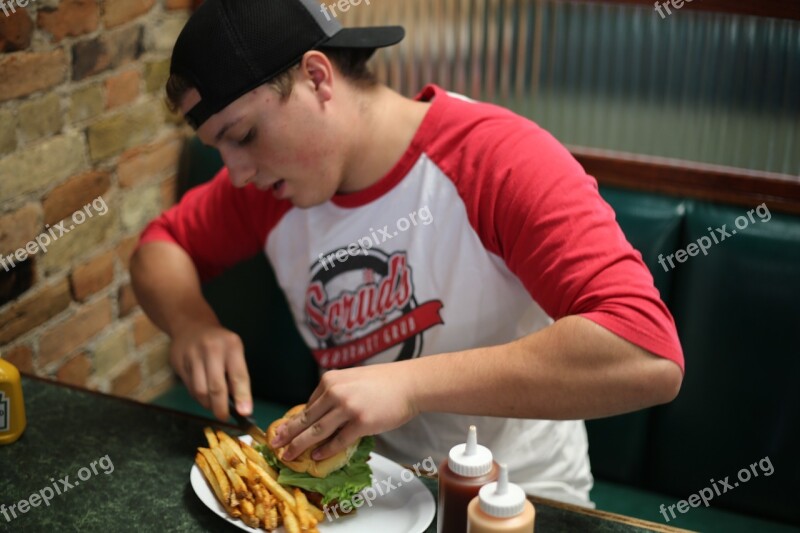 Man Eating Male Indoors Booth