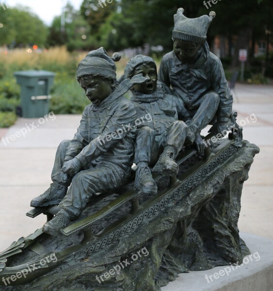 Statue Outside Children Sled Outdoors