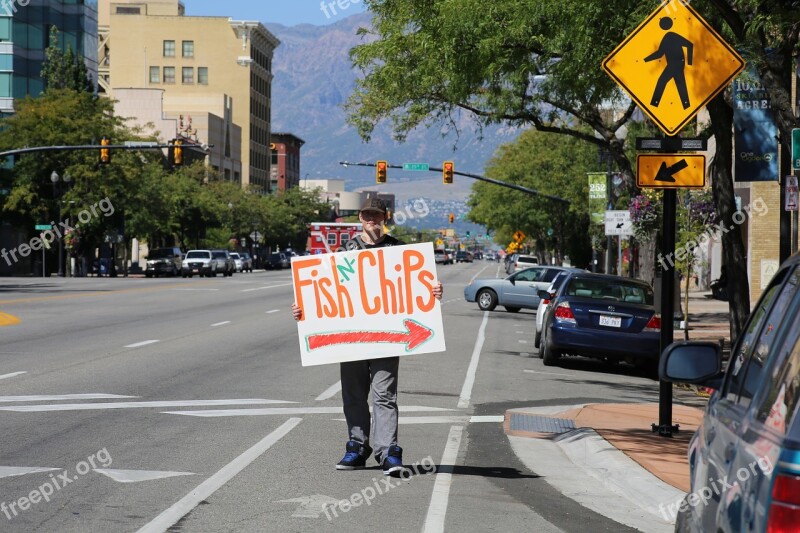 Man Outside Sign Advertising Board