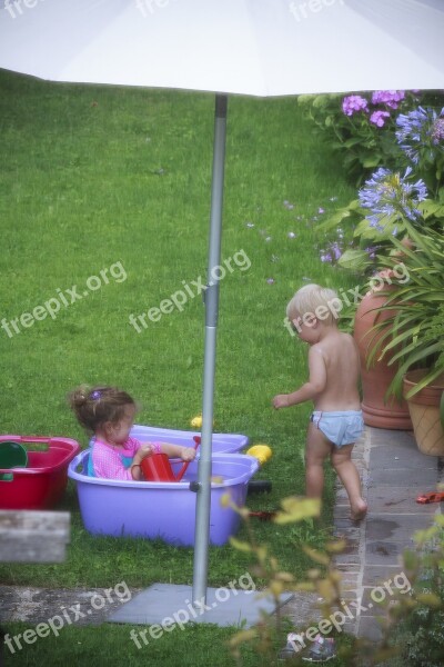 Children Swim In The Free Garden Bath