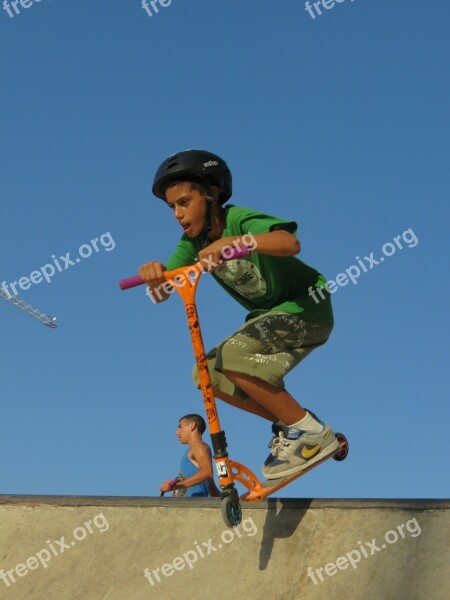 Scooter Kid Stunt Jumping Half Pipe