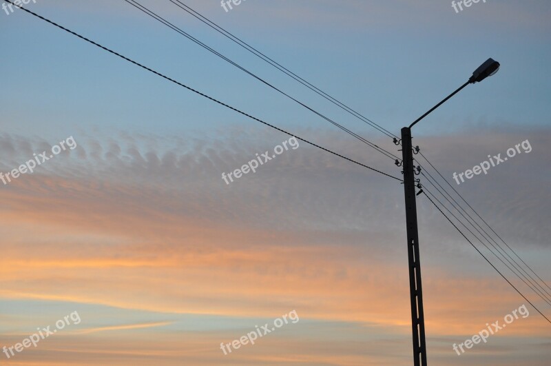 Lantern High-voltage Line Sunset Sky Clouds