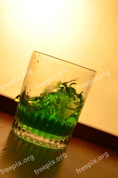 Liquid Green Glass Splash Pouring