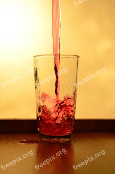 Liquid Red Glass Splash Pouring