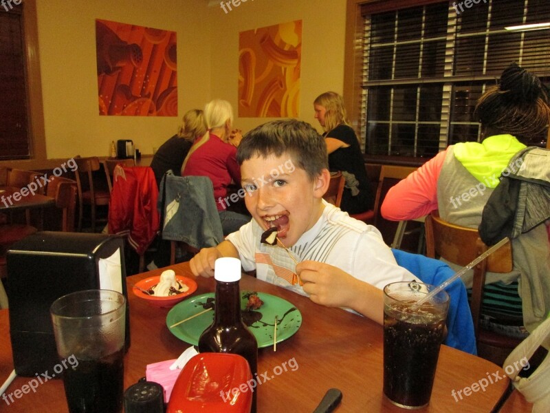 Boy Eating Chocolate Fast Food Restaurant