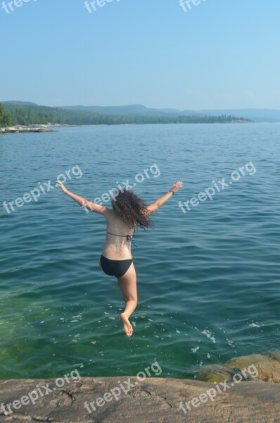 Girl Jumping Into Water Swimming Rock Jump Recreation Outdoor