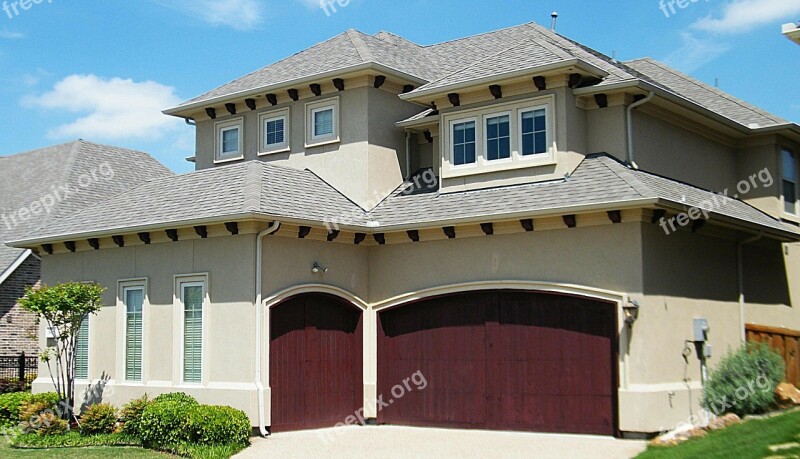 Spanish Style Home House Residence Maroon Garage Doors Blue Sky